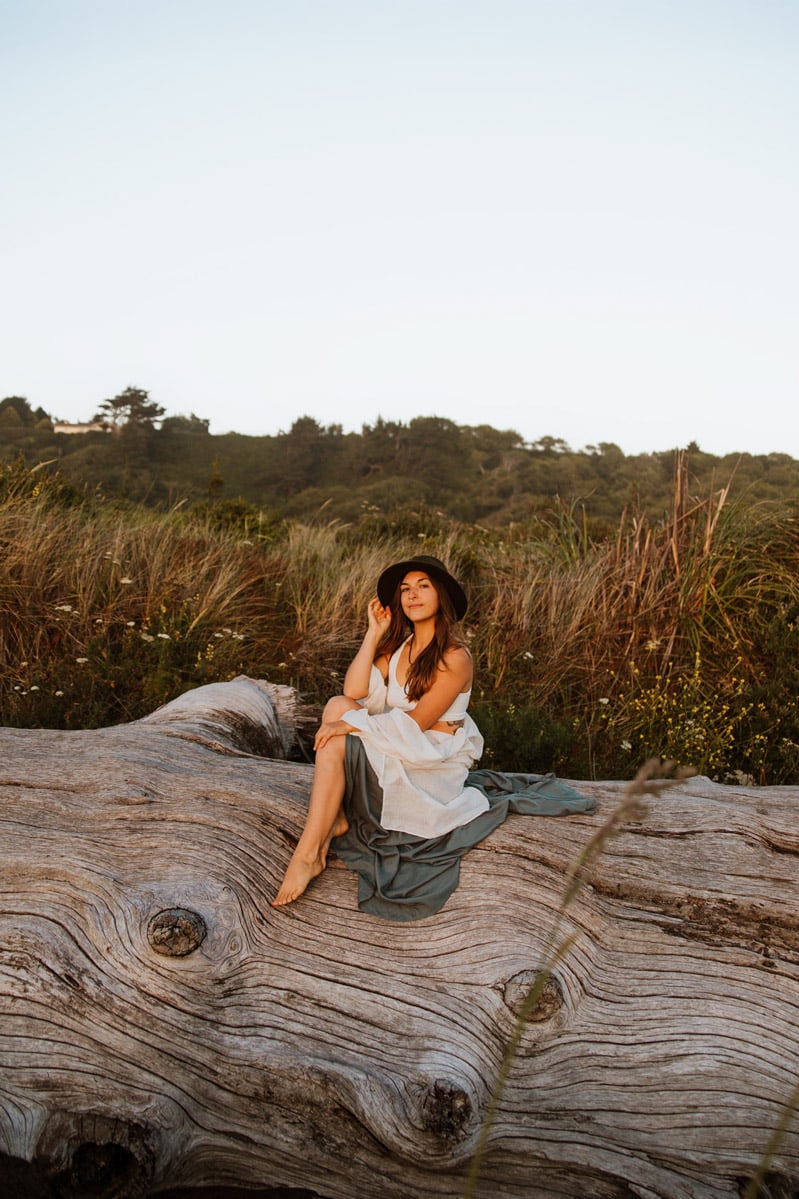 somatic embodiment coach arise alchemy sitting on a log